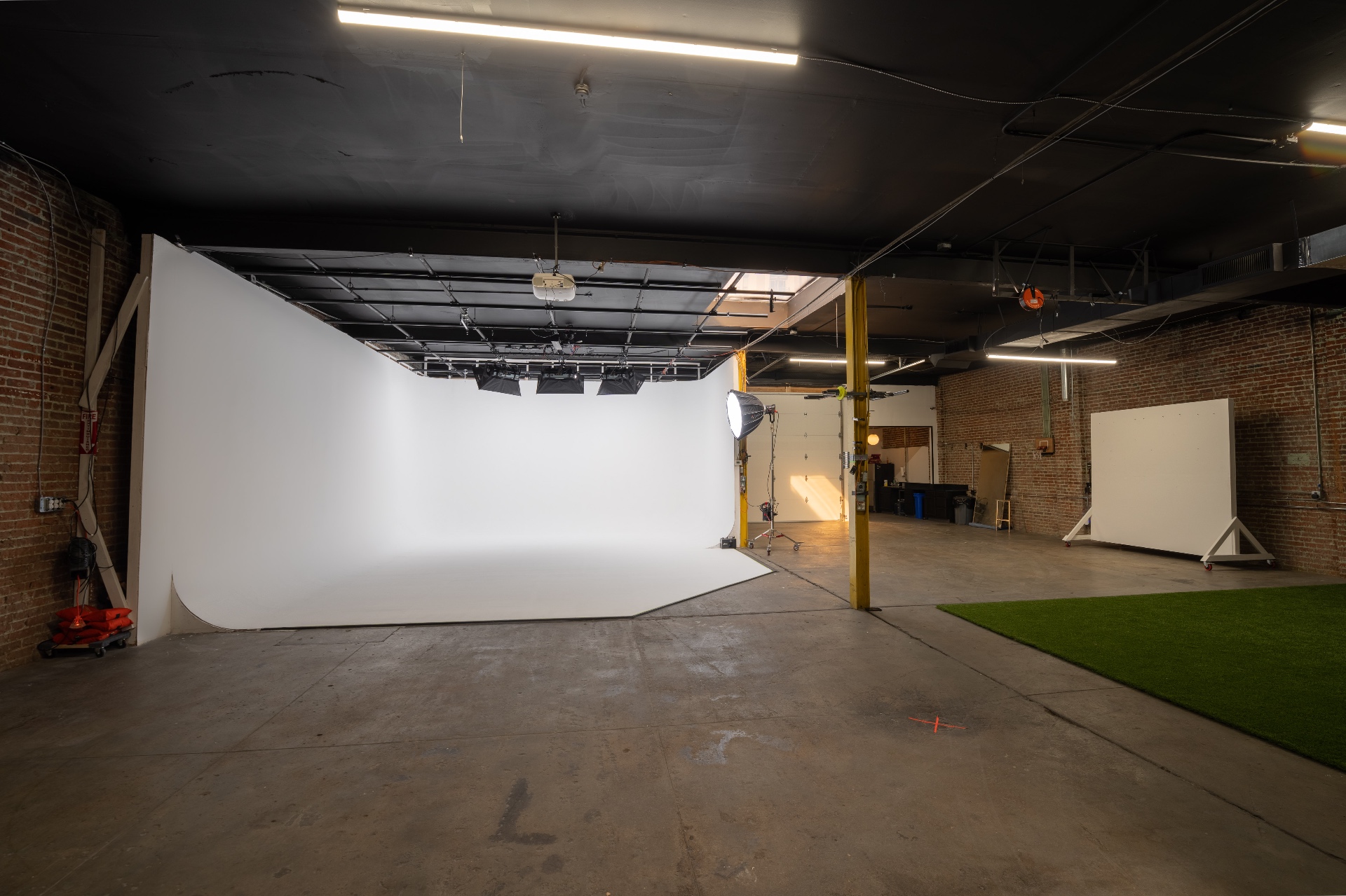 The infinite white cyc wall, lit theatrically